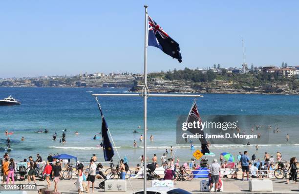 Hundreds of people enjoying the sun at Bondi Beach on August 30, 2020 in Sydney, Australia. Warm winter weather is being enjoyed across the entire...