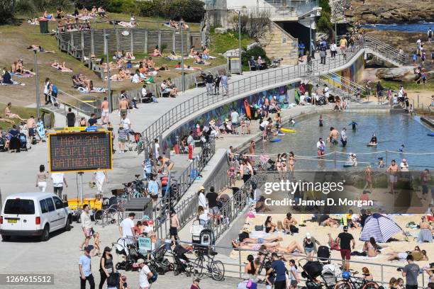 Digital display warning beachgoers regarding Covid-19 at Bondi Beach on August 30, 2020 in Sydney, Australia. Warm winter weather is being enjoyed...