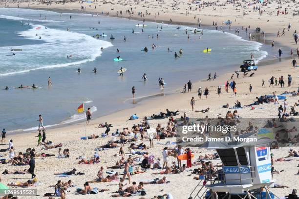 Hundreds of people enjoying the sun at Bondi Beach on August 30, 2020 in Sydney, Australia. Warm winter weather is being enjoyed across the entire...