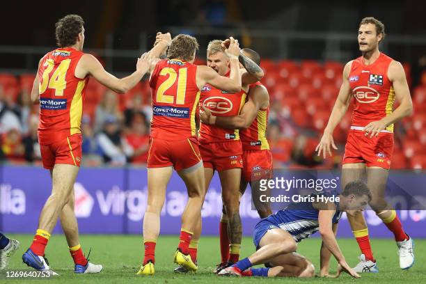 Brandon Ellis of the Suns celebrates a goal during the round 14 AFL match between the Gold Coast Suns and the North Melbourne Kangaroos at Metricon...