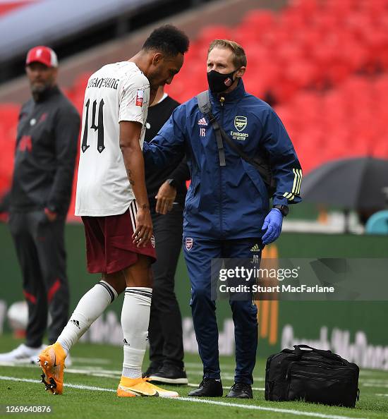 Jordan Reece Arsenal physio Jordan Reece treats Pierre-Emerick Aubameyang during ...