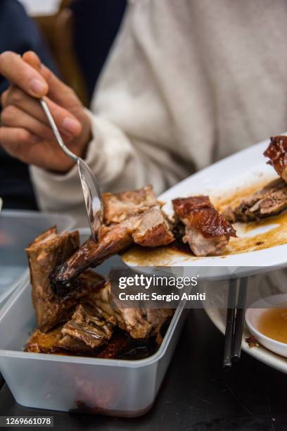 chinese roast duck into a takeout container - restaurant doggy bag stock pictures, royalty-free photos & images