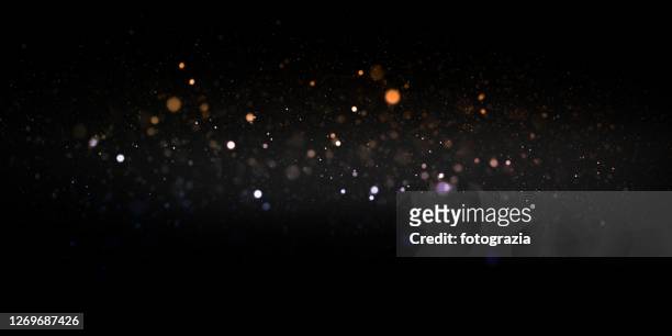 defocused lights and dust particles - illuminated stock pictures, royalty-free photos & images
