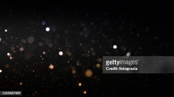 defocused lights and dust particles - star space stock pictures, royalty-free photos & images