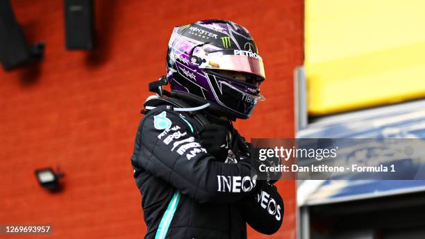 Race winner Lewis Hamilton of Great Britain and Mercedes GP celebrates in parc ferme with a tribute to the late Chadwick Boseman during the F1 Grand...