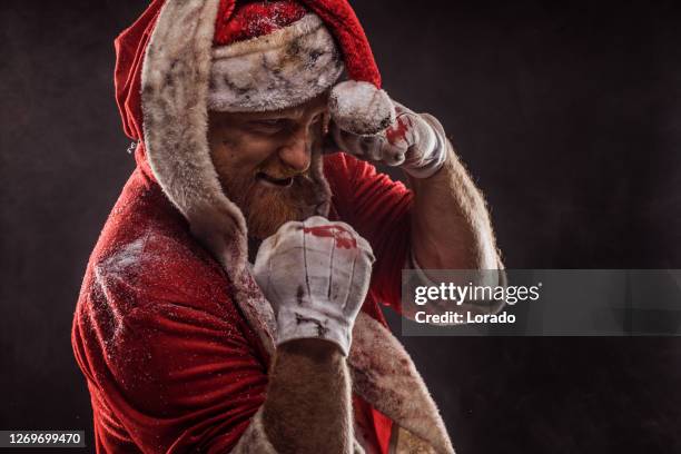 bad ass redhead santa claus fighter - dirty santa stockfoto's en -beelden