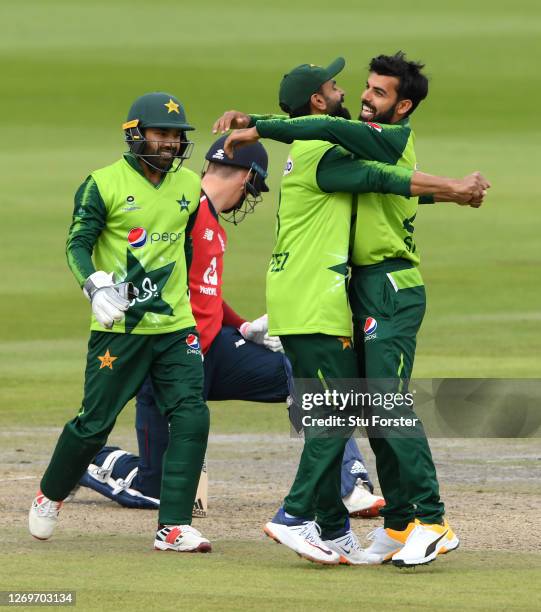 Shadab Khan of Pakistan celebrates the wicket of Tom Banton of England with Mohammad Hafeez and Mohammad Rizwan during the 2nd Vitality International...