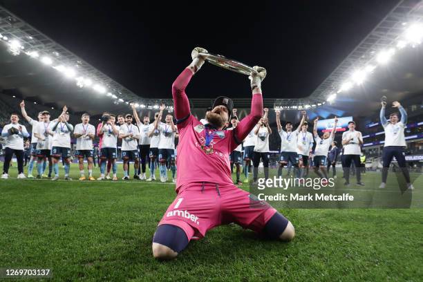 Andrew Redmayne of Sydney FC celebrates with the A-League trophy after winning the 2020 A-League Grand Final match between Sydney FC and Melbourne...