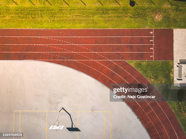 top view of a numbered running tracks at sports athletic stadium - athleticism imagens e fotografias de stock