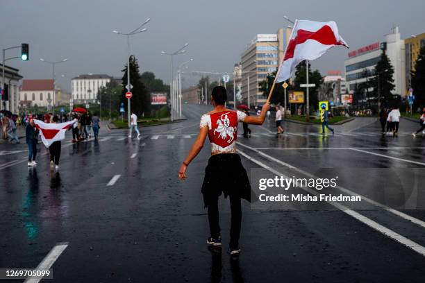 People take part in an anti-governmental rally in the rain on August 30, 2020 in Minsk, Belarus. There have been near daily demonstrations after the...