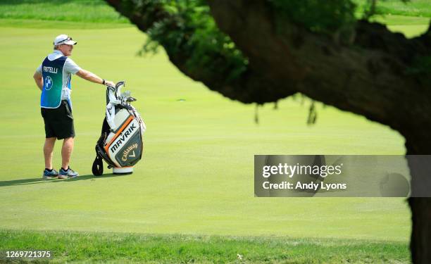 John Curtis, caddie to Dylan Frittelli of South Africa, stands on the seventh fairway during the final round of the BMW Championship on the North...