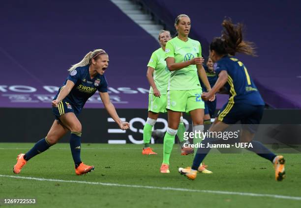 Eugenie Le Sommer of Olympique Lyon celebrates with teammate Amel Majri after scoring her team's first goal during the UEFA Women's Champions League...