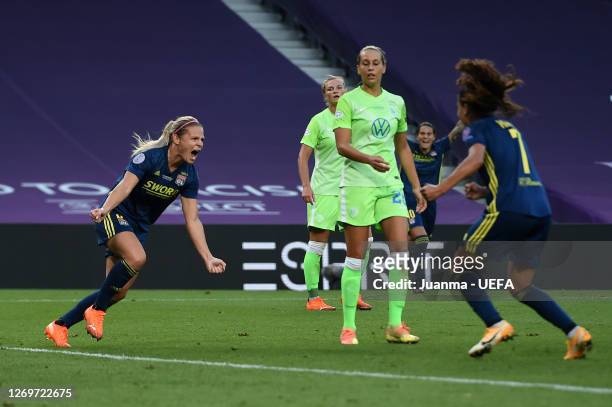 Eugenie Le Sommer of Olympique Lyon celebrates with teammate Amel Majri after scoring her team's first goal during the UEFA Women's Champions League...