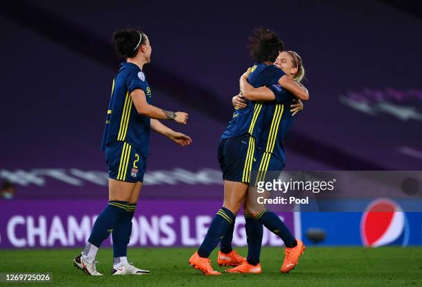 Saki Kumagai of Olympique Lyon celebrates with teammate Eugenie Le Sommer after scoring her team's second goal during the UEFA Women's Champions...