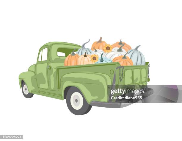 vintage truck filled with pumpkins - farm truck stock illustrations