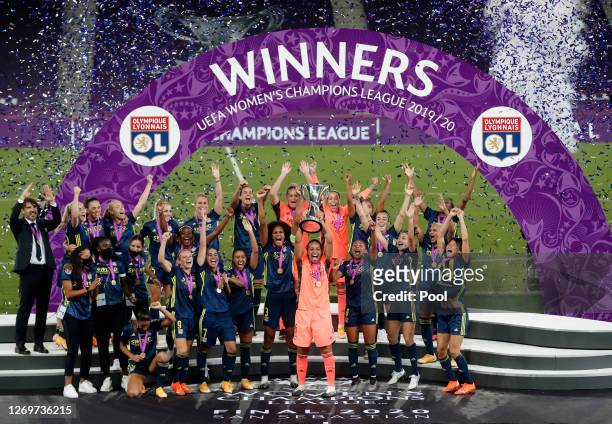 Sarah Bouhaddi of Olympique Lyon lifts the UEFA Women's Champions League Trophy following her team's victory in the UEFA Women's Champions League...