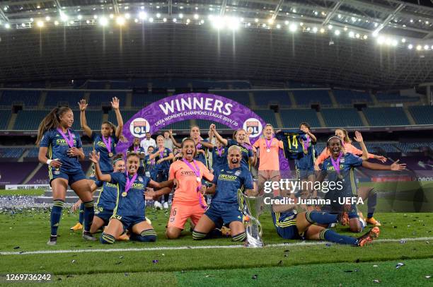 Olympique Lyon players celebrate with the UEFA Women's Champions League Trophy following their team's victory in the UEFA Women's Champions League...