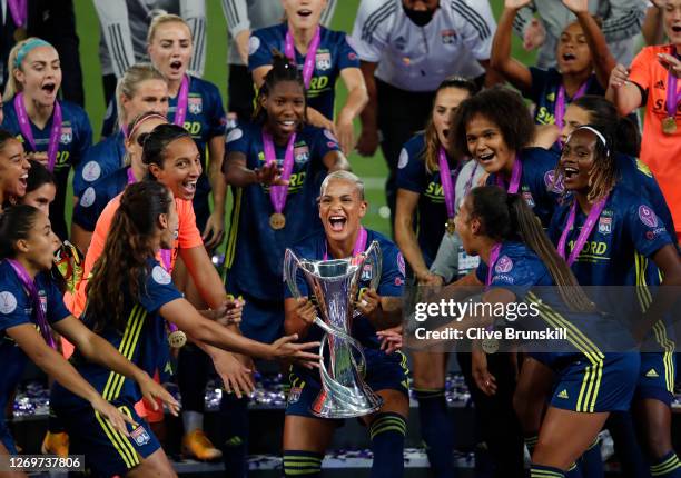 Shanice van de Sanden of Olympique Lyon celebrates with the UEFA Women's Champions League Trophy following her team's victory in the UEFA Women's...