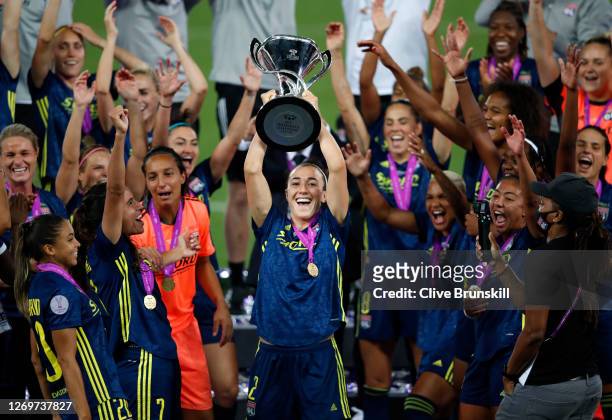 Lucy Bronze of Olympique Lyon lifts the UEFA Women's Champions League Trophy following her team's victory in the UEFA Women's Champions League Final...