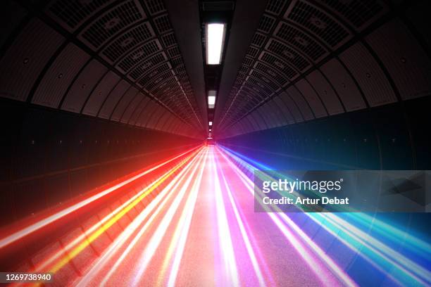 futuristic picture of colorful light trails moving fast in subway tunnel. - perfection stock pictures, royalty-free photos & images