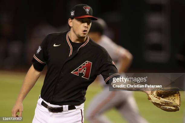 Starting pitcher Taylor Clarke of the Arizona Diamondbacks reacts after giving up a solo home run to Alex Dickerson of the San Francisco Giants...