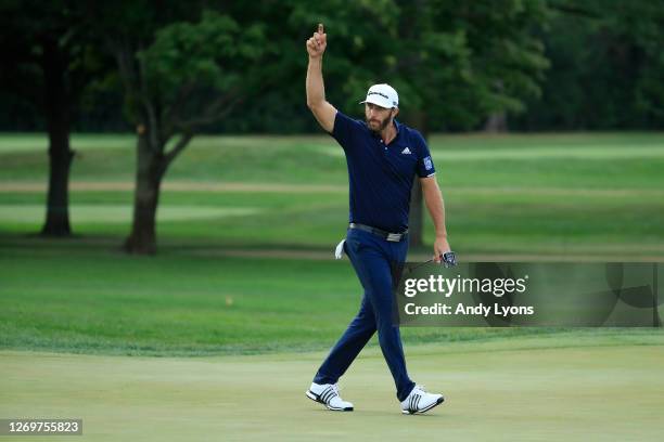 Dustin Johnson of the United States celebrates making his putt for birdie on the 18th hole during the final round of the BMW Championship on the...