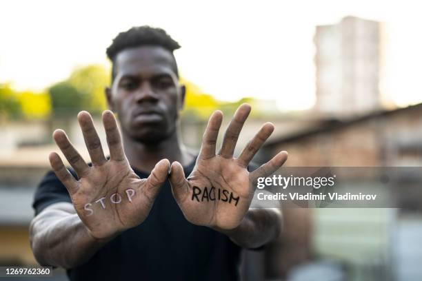 "stop racism" message concept - racismo imagens e fotografias de stock