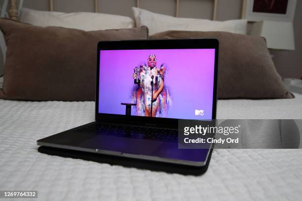 In this photo illustration, Lady Gaga accepts the Best Collaboration award for "Rain on Me" with Ariana Grande, viewed on a laptop, during the 2020...