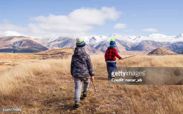 kids on adventure. - new zealand rural stock pictures, royalty-free photos & images