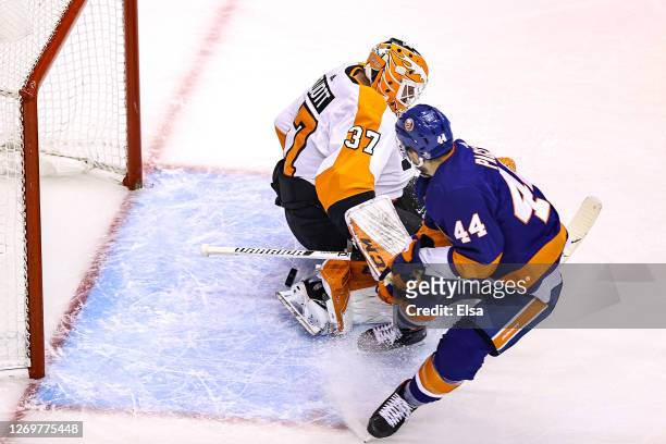 Jean-Gabriel Pageau of the New York Islanders scores a goal past Brian Elliott of the Philadelphia Flyers during the third period in Game Four of the...