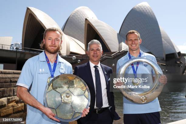 Rhyan Grant, Steve Corica and Alex Wilkinson poses with the A-League Premiers' Plate and A-League Trophy during an A-League media opportunity after...