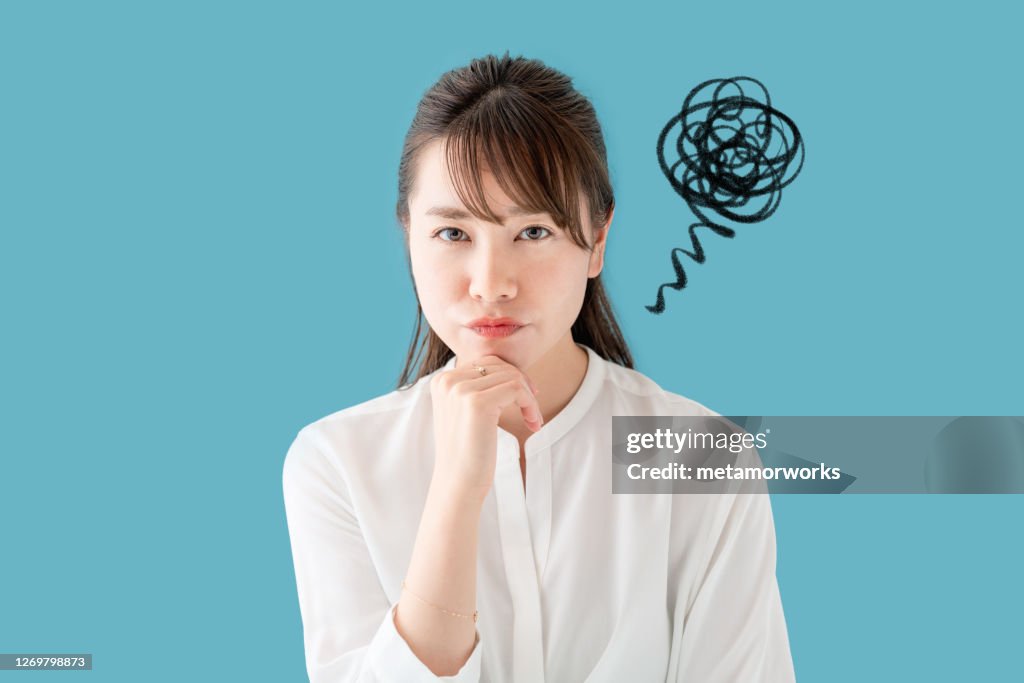Unsatisfying young asian woman. Discontent.