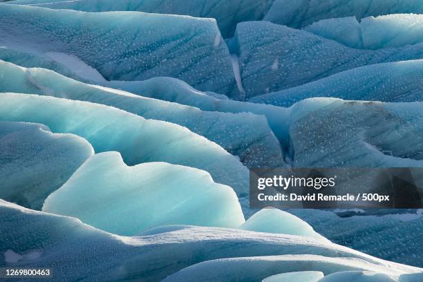 full frame shot of glacier - gletscher stock-fotos und bilder