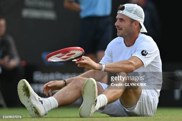 Player Tommy Paul falls while playing US player Jeffrey John Wolf during their men's singles quarter-final tennis match at the Rothesay Eastbourne...