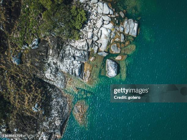 rocks of little island in the lake malawi - lake malawi stock pictures, royalty-free photos & images