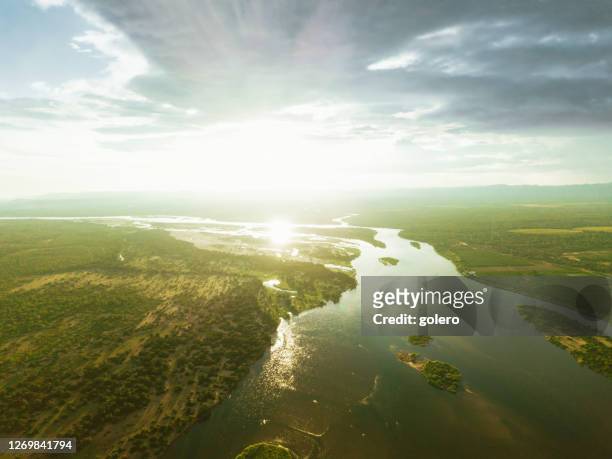 lower zambezi river at sunset hour - zambezi river stock pictures, royalty-free photos & images