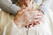Cropped shot of elderly female's hands.