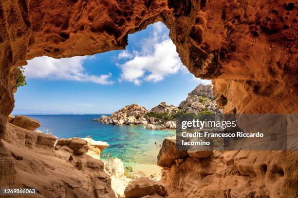 cala spinosa, cave on the sea bay in gallura, sardinia, italy - sardegna foto e immagini stock