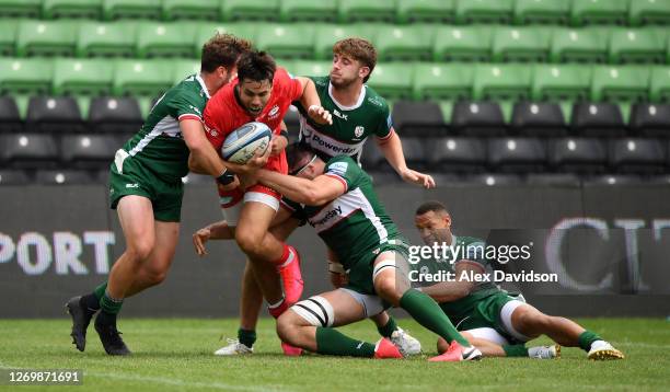 Sean Maitland of Saracens is stopped short of the line by James Stokes of London Irish , Dan Norton of London Irish and teammates during the...