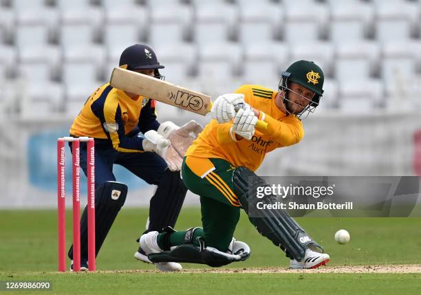 Ben Duckett of Notts Outlaws plays a shot as Yorkshire Vikings wicket keeper Jonathan Tattersall looks on during the T20 Vitality Blast 2020 match...