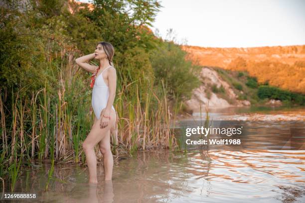 happy woman having fun on lake - woman rubber ring stock pictures, royalty-free photos & images