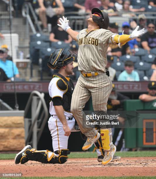 Ha-Seong Kim of the San Diego Padres reacts as he crosses home plate after hitting a solo home run in the fourth inning during the game against the...
