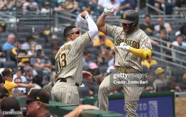 Ha-Seong Kim of the San Diego Padres celebrates with Manny Machado after hitting a solo home run in the fourth inning during the game against the...