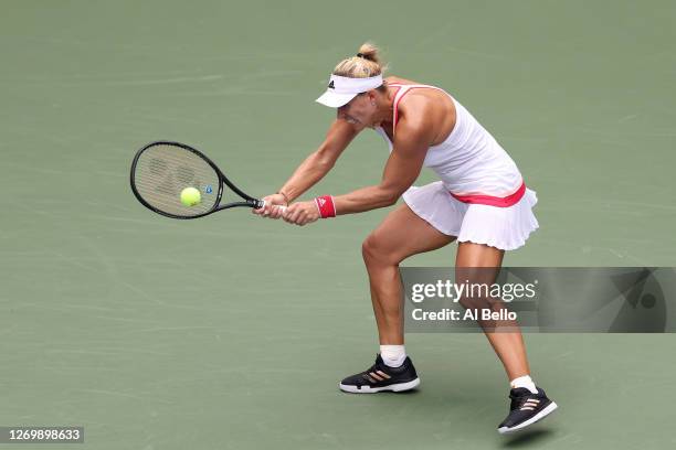 Angelique Kerber of Germany returns a shot during her Women's Singles first round match against Ajla Tomljanovic of Australia on Day One of the 2020...