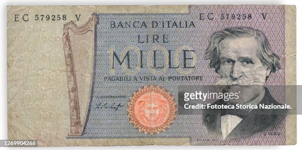 Italian 1000 Liras banknote with the portrait of Giuseppe Verdi, musician, composer; on the back is the facade of the Teatro alla Scala in Milan....
