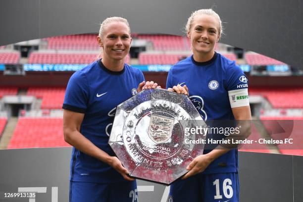 Jonna Andersson and Magdalena Eriksson of Chelsea celebrate with the FA Women's Community Shield following their team's victory in the Women's FA...