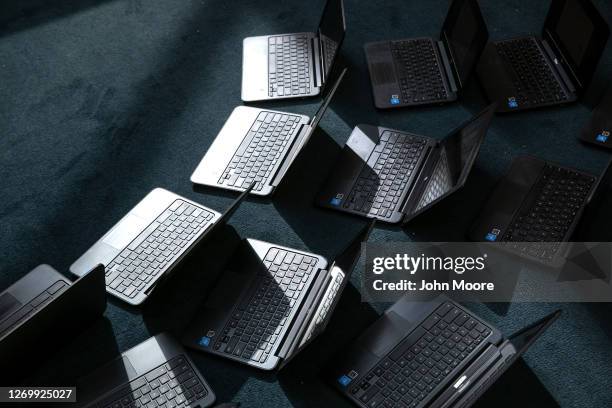 Chromebooks lie out after being cleaned in preparation for the Sept. 8 start of school at Newfield Elementary School on August 31, 2020 in Stamford,...