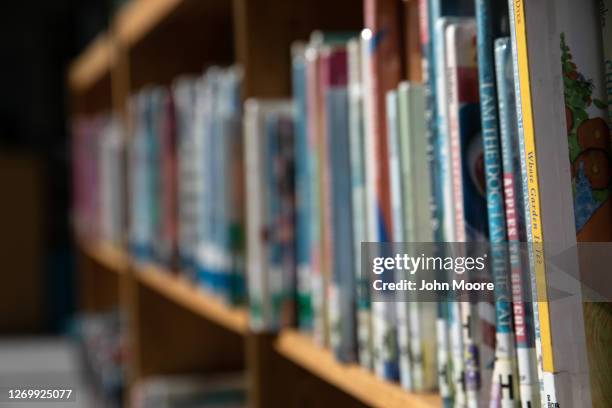 Bookshelves of library books stand reflected in the media center of the Newfield Elementary School on August 31, 2020 in Stamford, Connecticut. The...