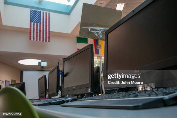 Desktop computers stand idle in the media center of the Newfield Elementary School on August 31, 2020 in Stamford, Connecticut. The school media...