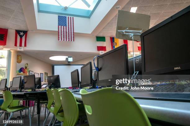 Desktop computers stand idle in the media center of the Newfield Elementary School on August 31, 2020 in Stamford, Connecticut. The school media...